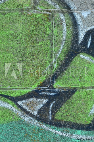 Afbeeldingen van Fragment of graffiti drawings The old wall decorated with paint stains in the style of street art culture Colored background texture in green tones